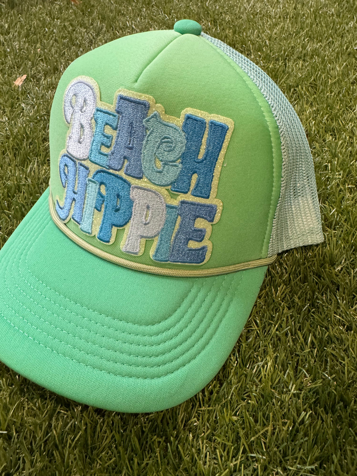 Beach Hippie on tricolor green magna pony trucker hat