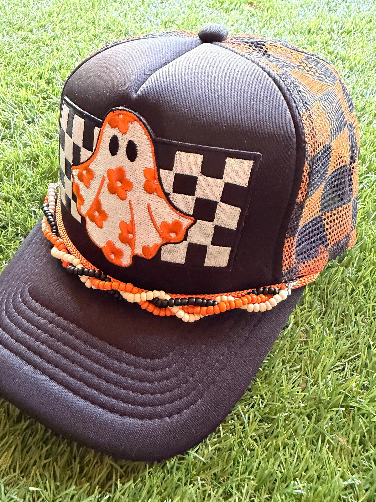 Ghost with floral sheet on custom mesh trucker hat with braided hat chain