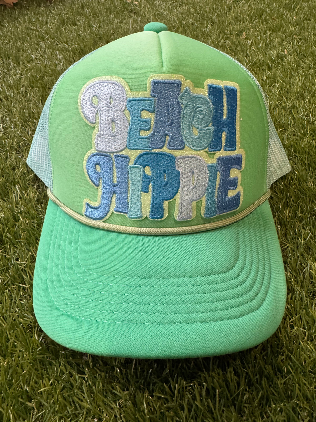Beach Hippie on tricolor green magna pony trucker hat
