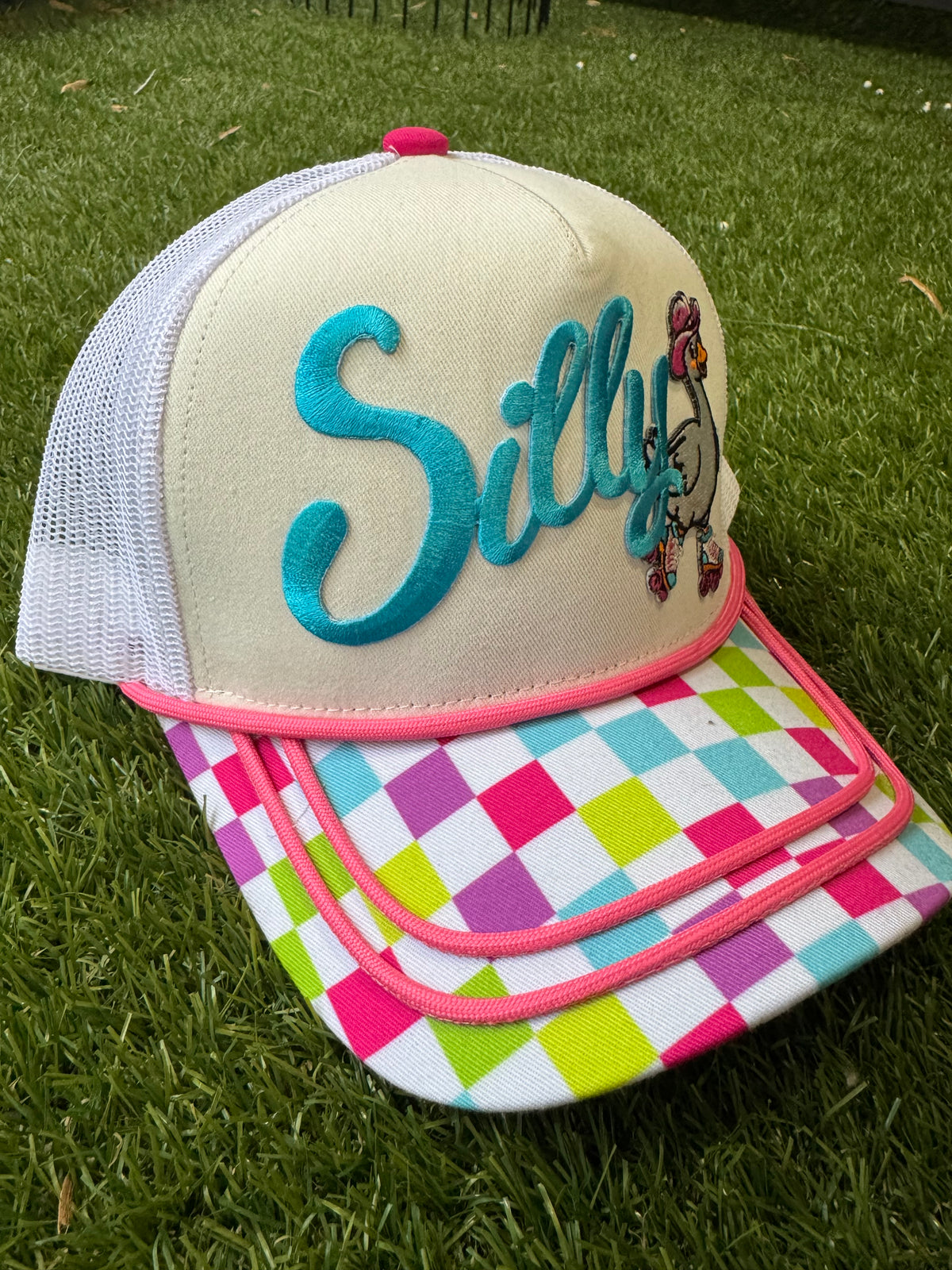 Silly Goose on skates on multicolored checkered brim canvas trucker hat
