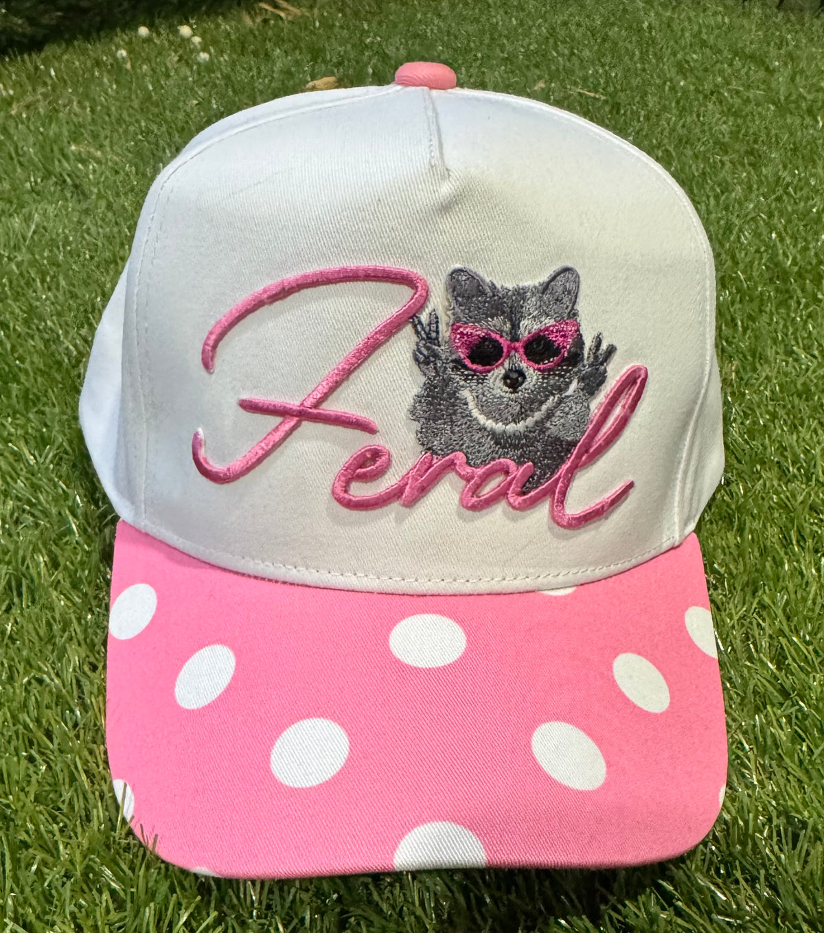 Feral Raccoon on pink polka dot canvas trucker hat