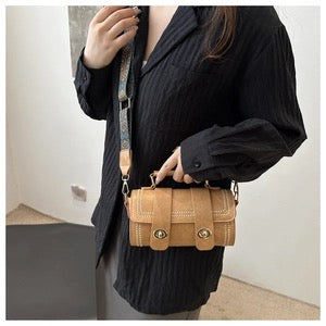 Women PU Leather Cylinder Crossbody Bag With Rivet Double Swivel Lock And Wide Ethnic Pattern Strap Vintage Handbag