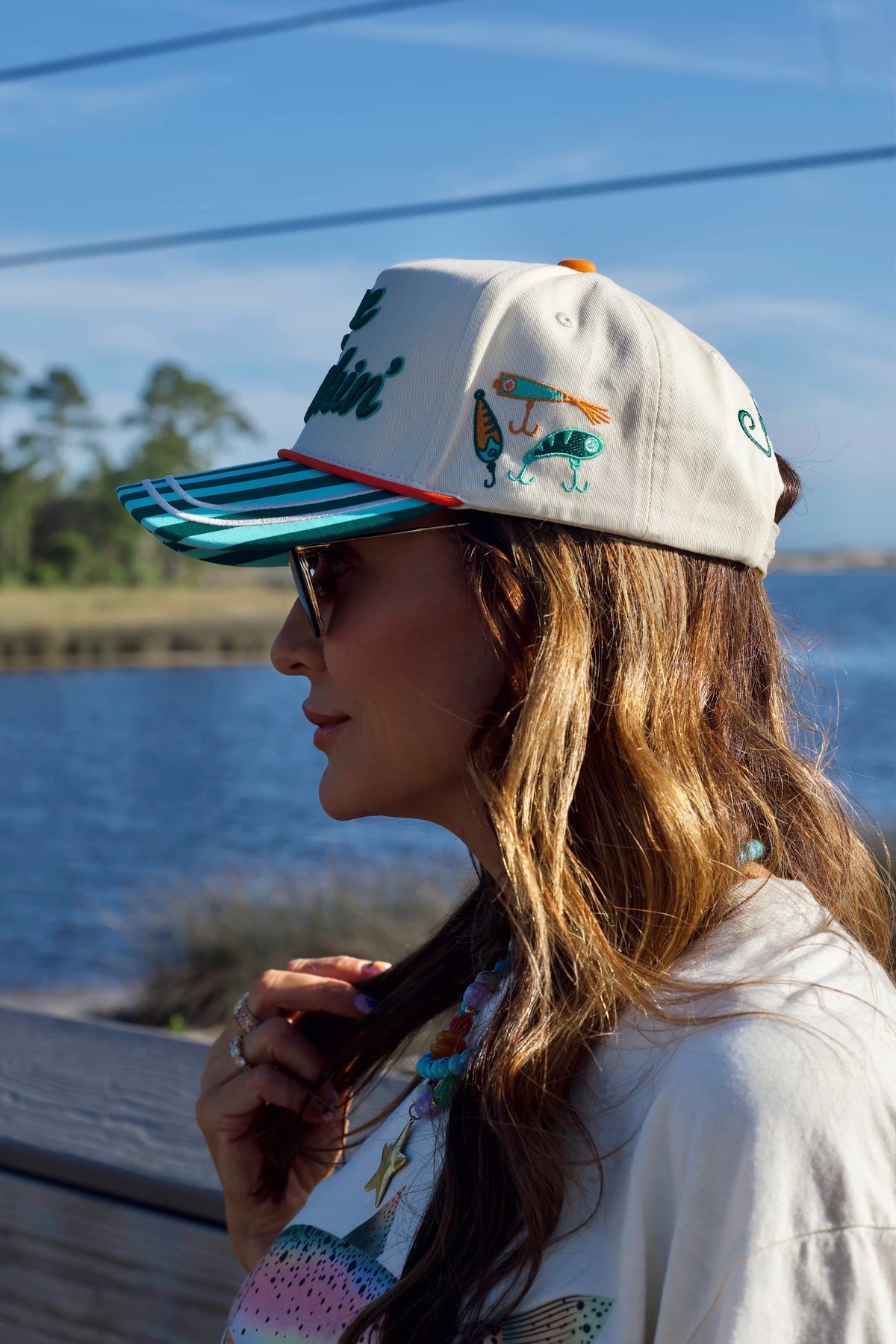 Gone Fishin' embroidered hat with embroidery side details and Catch Ya Later embroidered on back