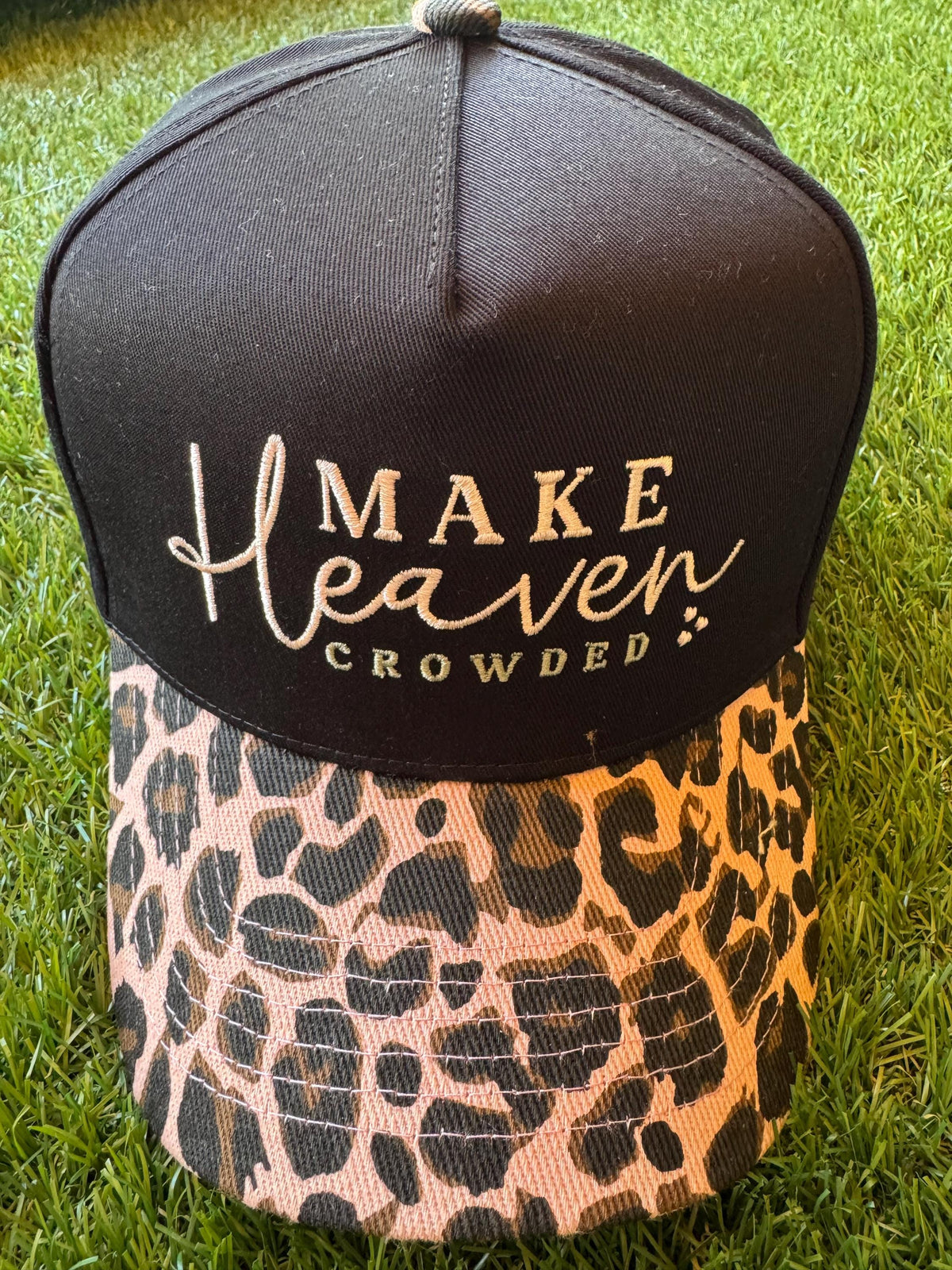 Make Heaven Crowded embroidered trucker hat with leopard brim and cross embroidered detail on side