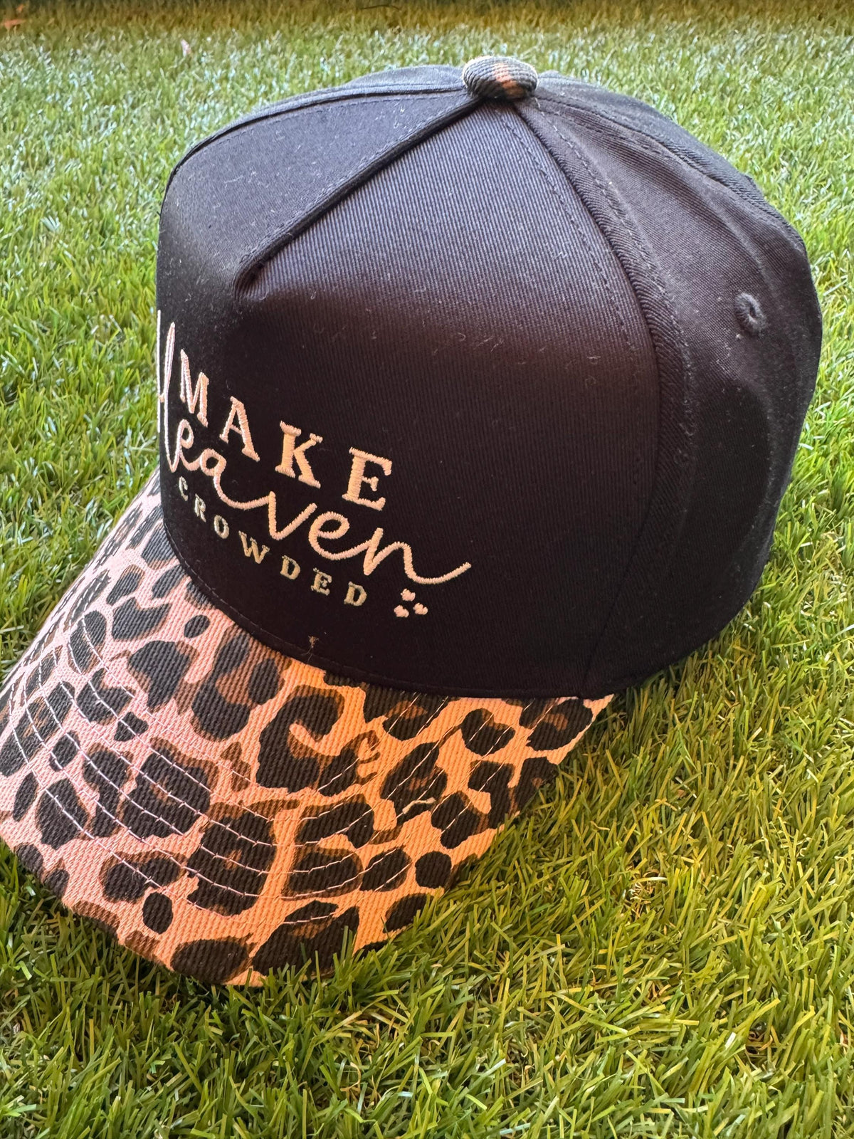 Make Heaven Crowded embroidered trucker hat with leopard brim and cross embroidered detail on side