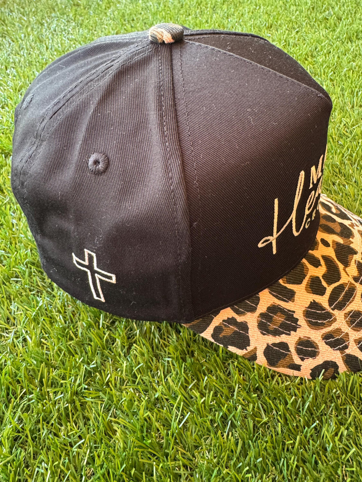 Make Heaven Crowded embroidered trucker hat with leopard brim and cross embroidered detail on side