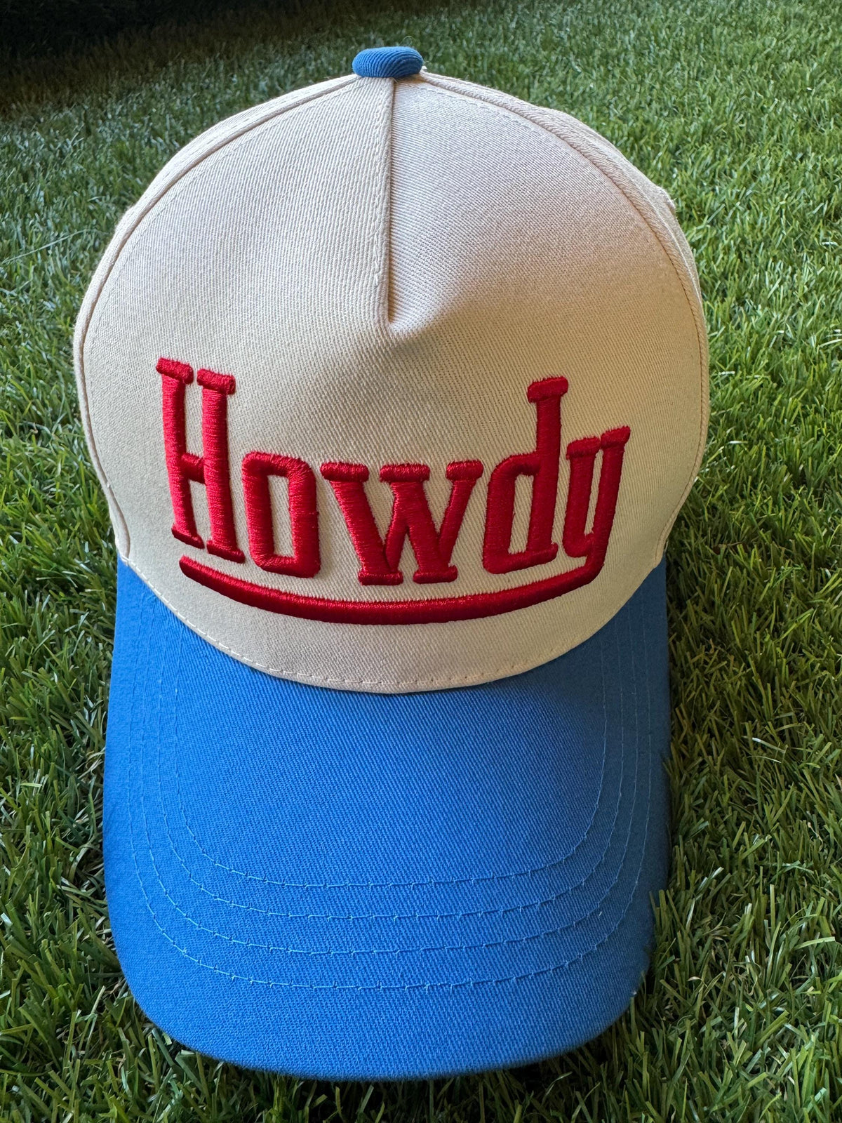 HOWDY embroidered canvas trucker hat with cowboy embroidered detail on side