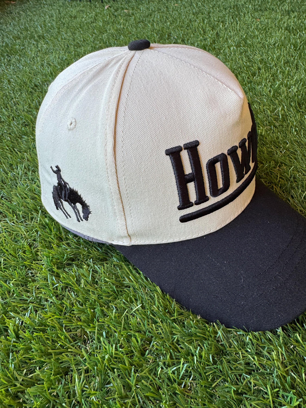 HOWDY embroidered canvas trucker hat with cowboy embroidered detail on side