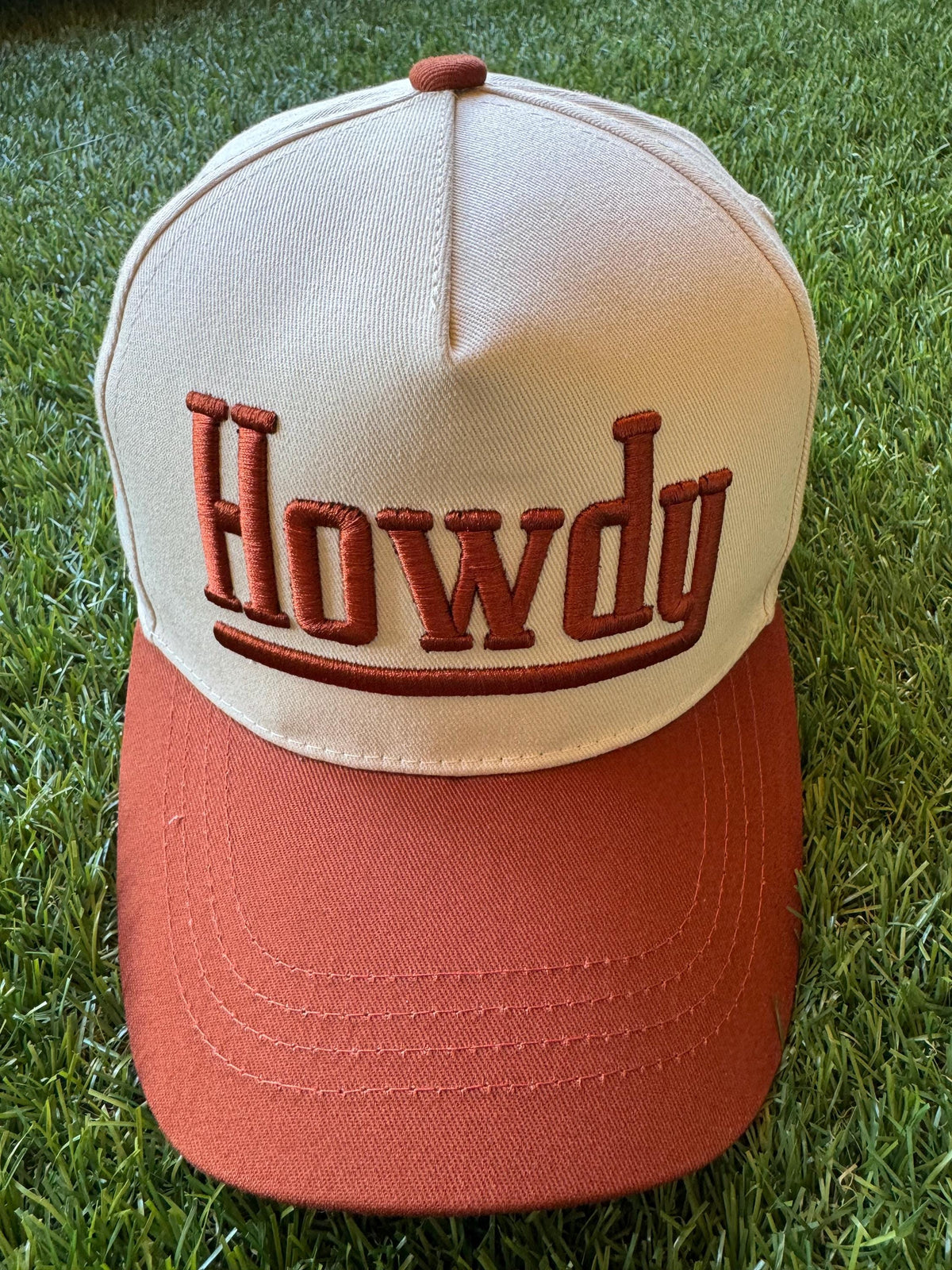 HOWDY embroidered canvas trucker hat with cowboy embroidered detail on side