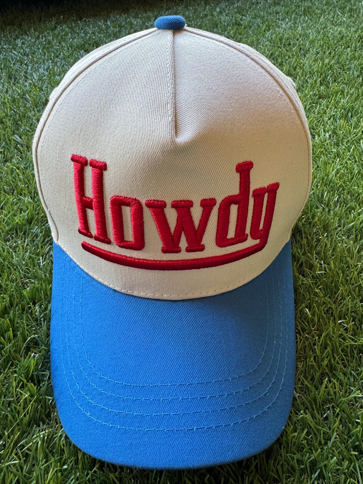 HOWDY embroidered canvas trucker hat with cowboy embroidered detail on side