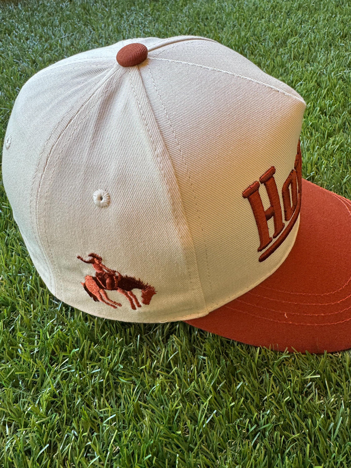 HOWDY embroidered canvas trucker hat with cowboy embroidered detail on side