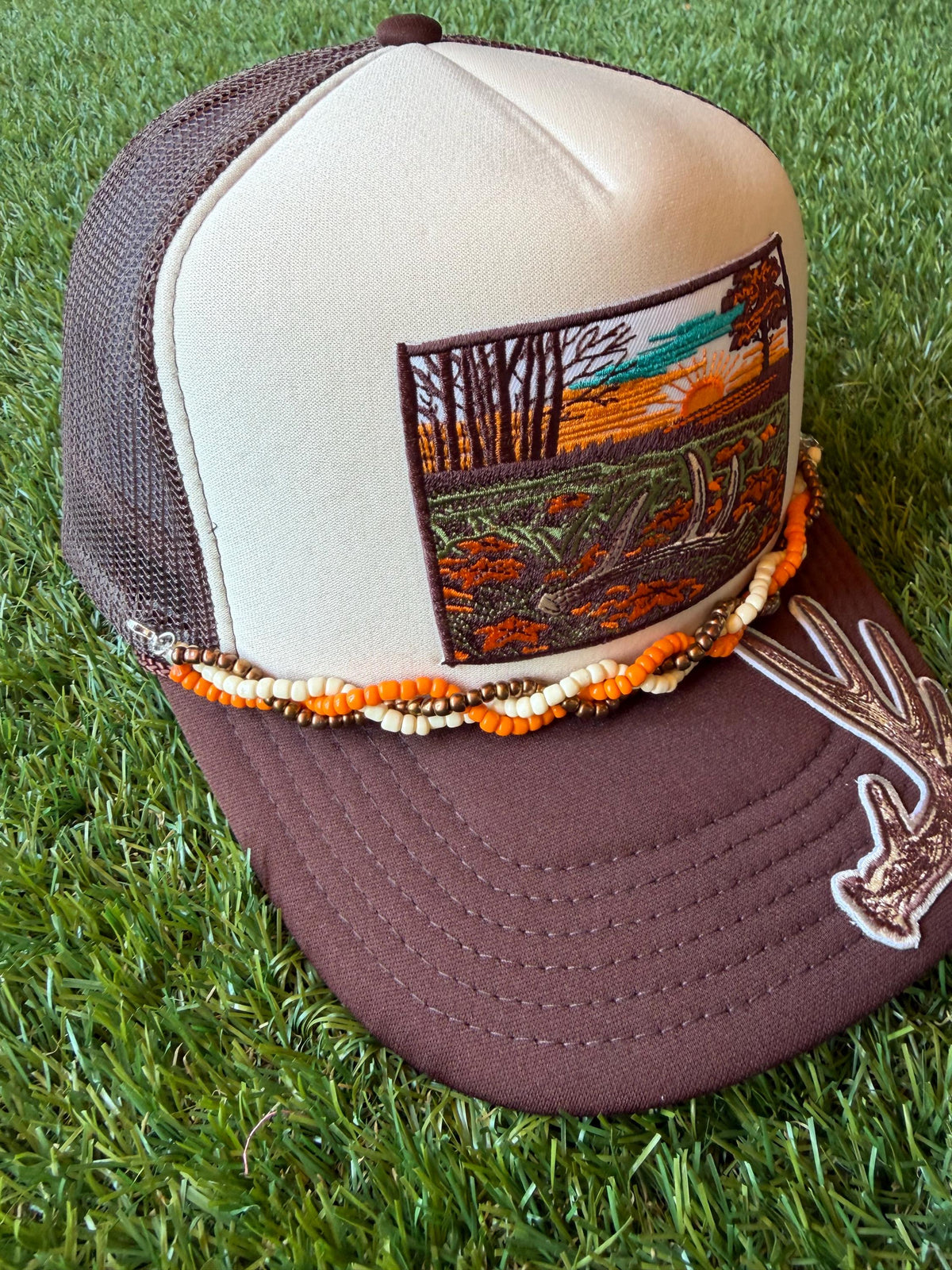 Deer Antler with Sunset embroidered patches on custom trucker hat with coordinating hat chain