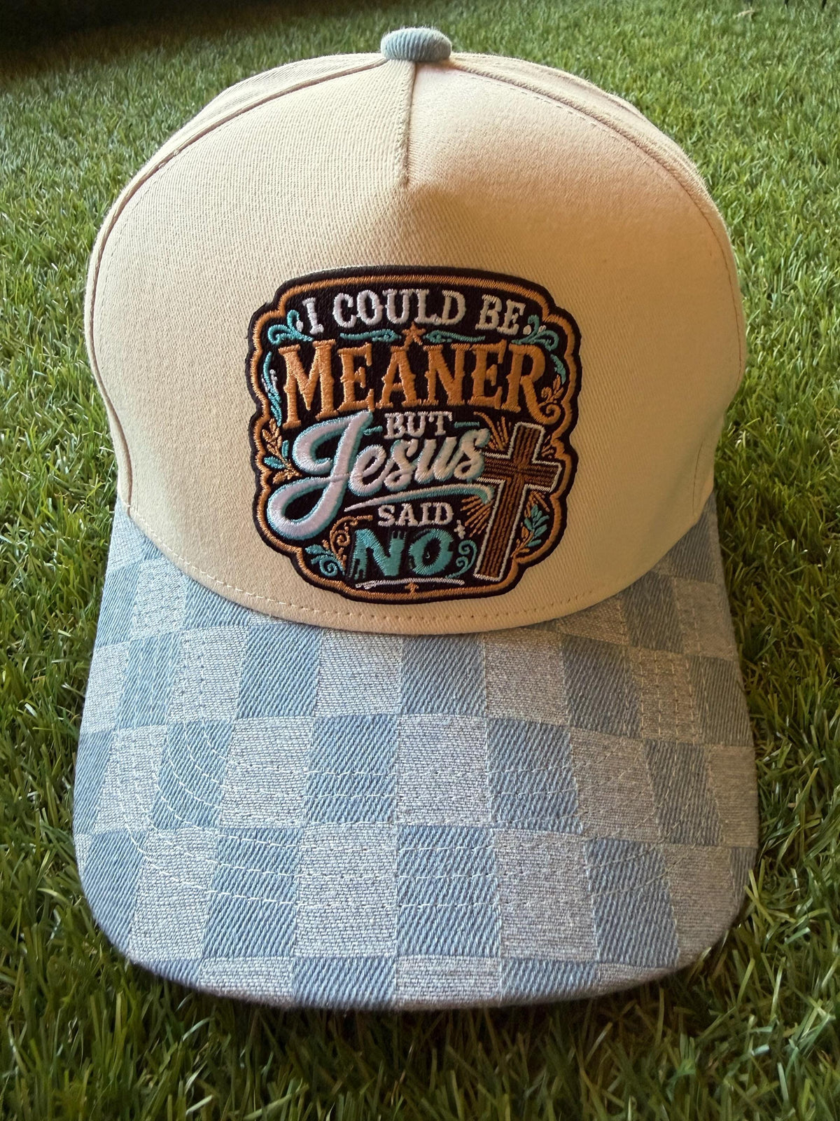 I Could Be Meaner but Jesus Said No on a custom canvas trucker hat with a checkered denim brim