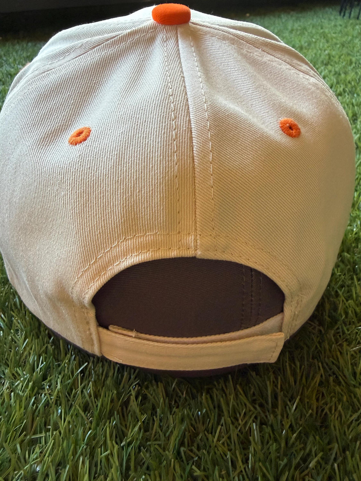 Candy Corn Cutie on a custom canvas trucker hat with orange and beige strips on the brim