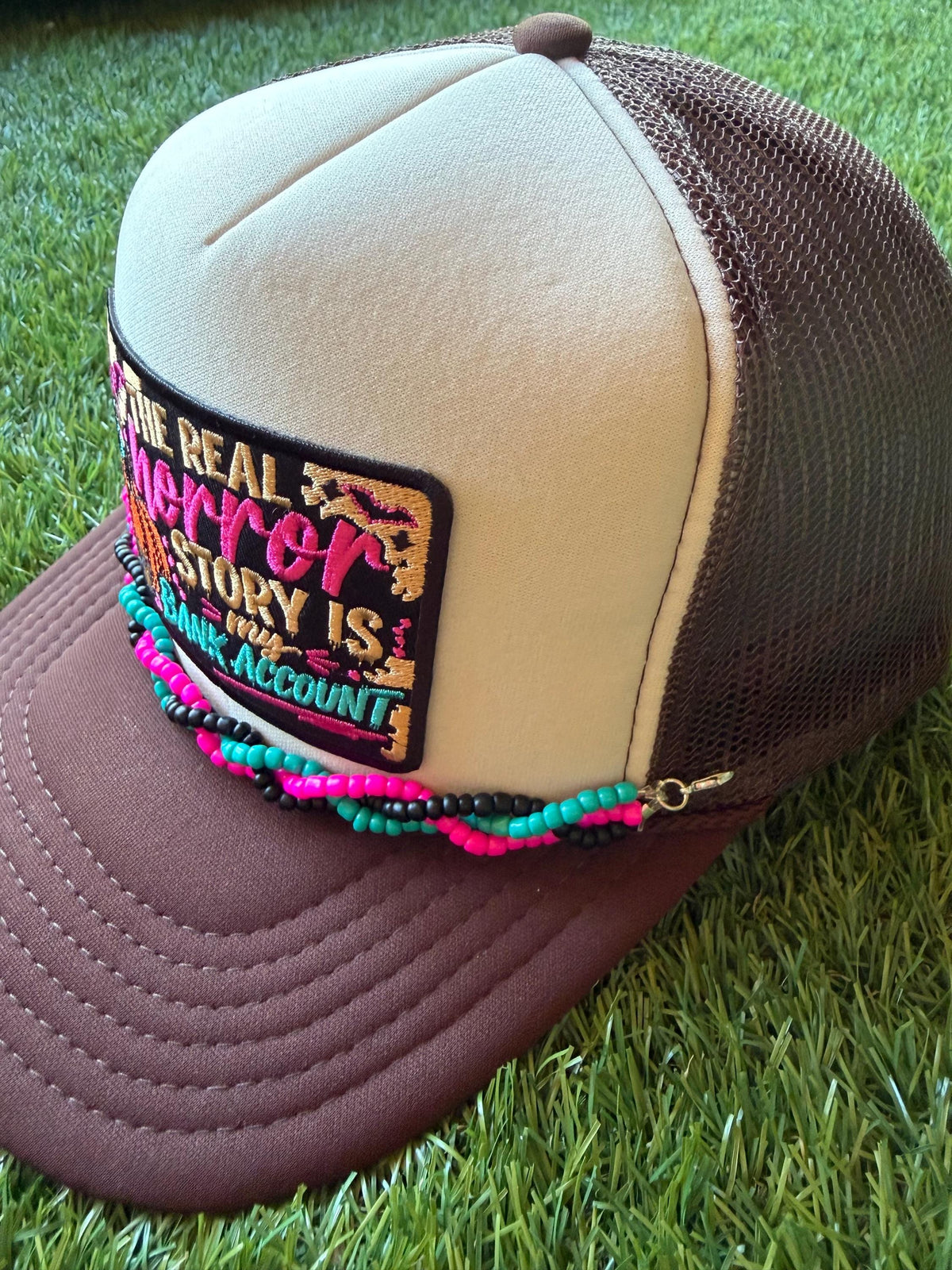 The Real Horror Story is My Bank Account on a custom mesh trucker hat with a coordinating rope hat chain