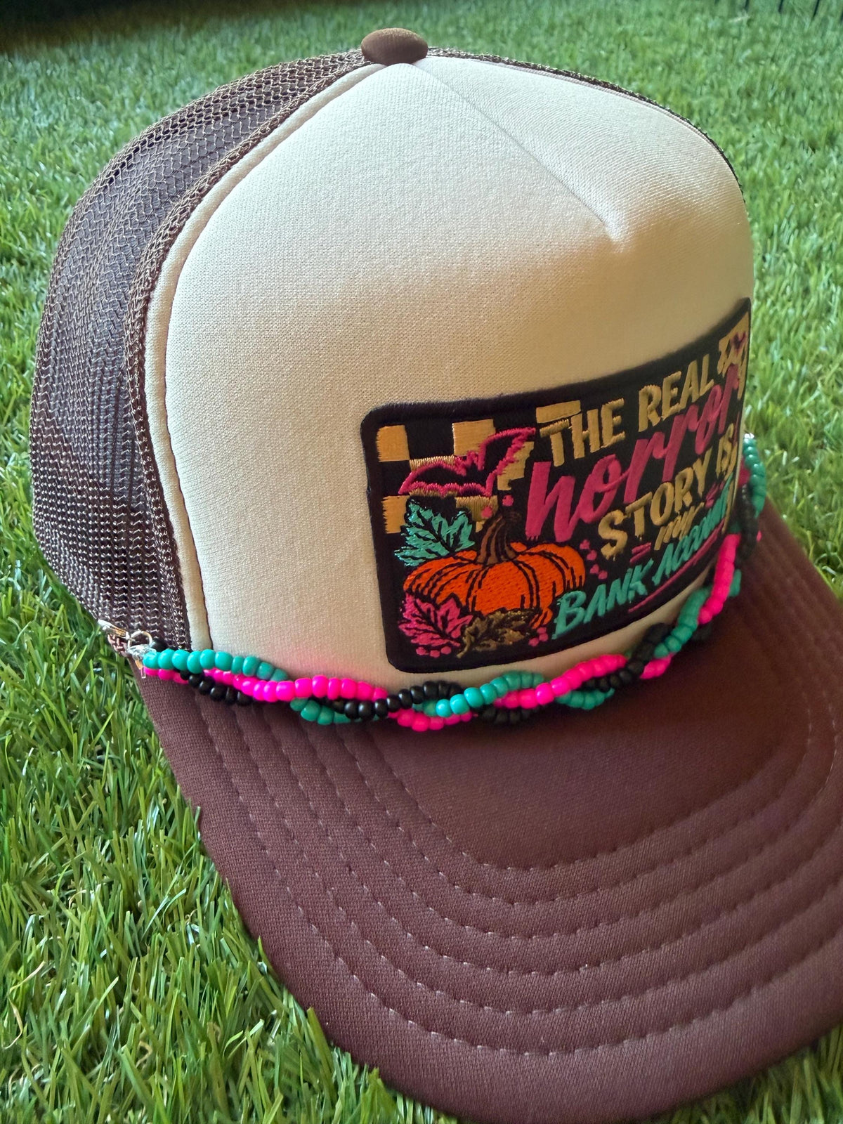 The Real Horror Story is My Bank Account on a custom mesh trucker hat with a coordinating rope hat chain