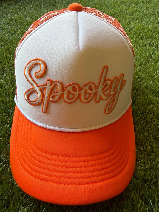 Spooky on a custom trucker hat with a magna pony and orange and white leopard detailed mesh