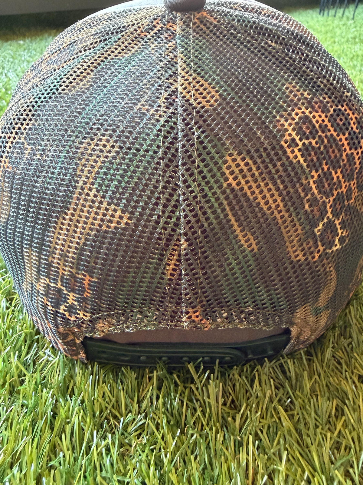 Talk To Me Goose with an image of a goose on a camouflage/leopard print custom canvas trucker hat