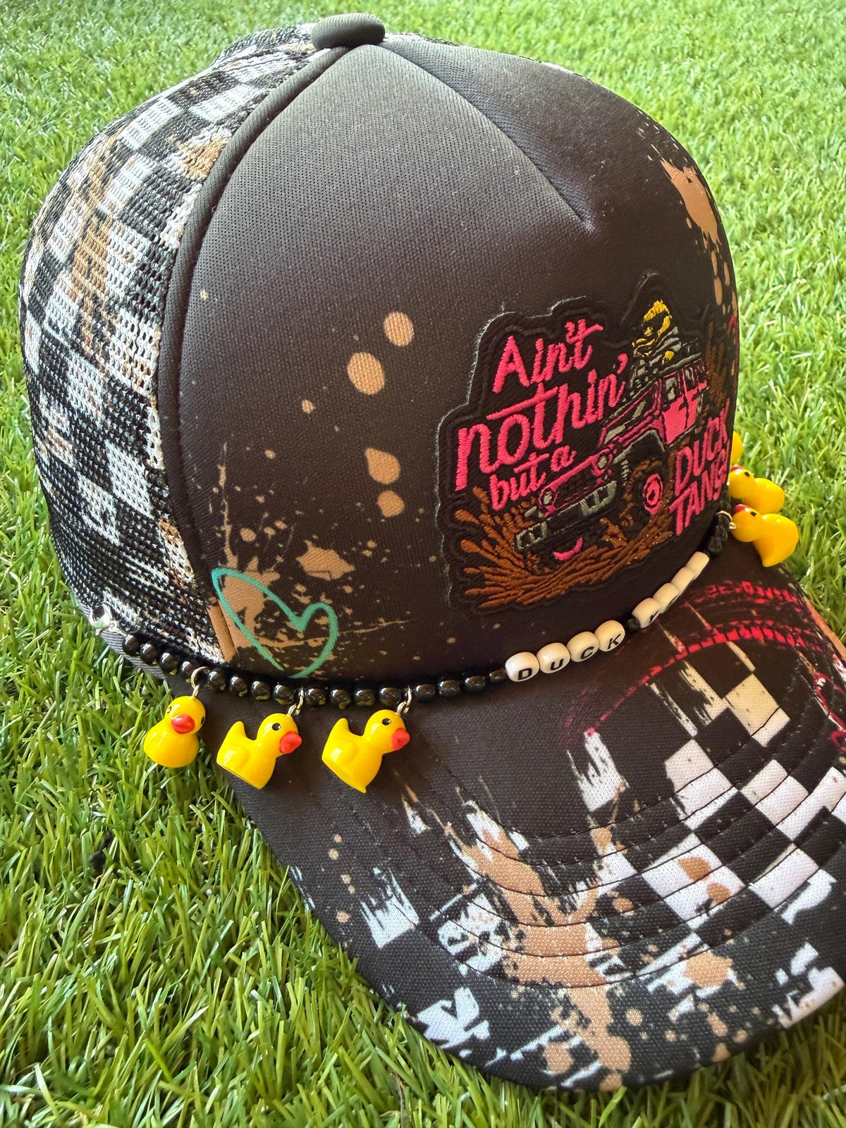 Ain’t Nothin But A Duck Tang on a custom mesh trucker hat with a duck hat chain
