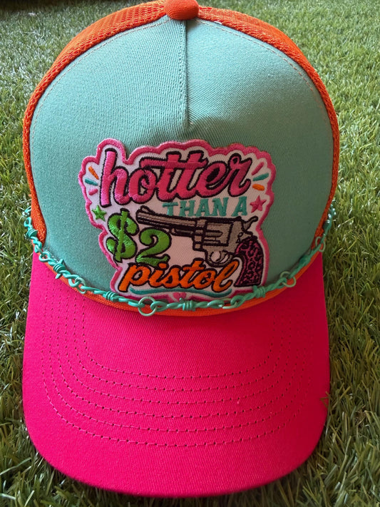 Hotter Than A 2 Dollar Pistel on a tri color canvas/mesh custom trucker hat with a hat chain