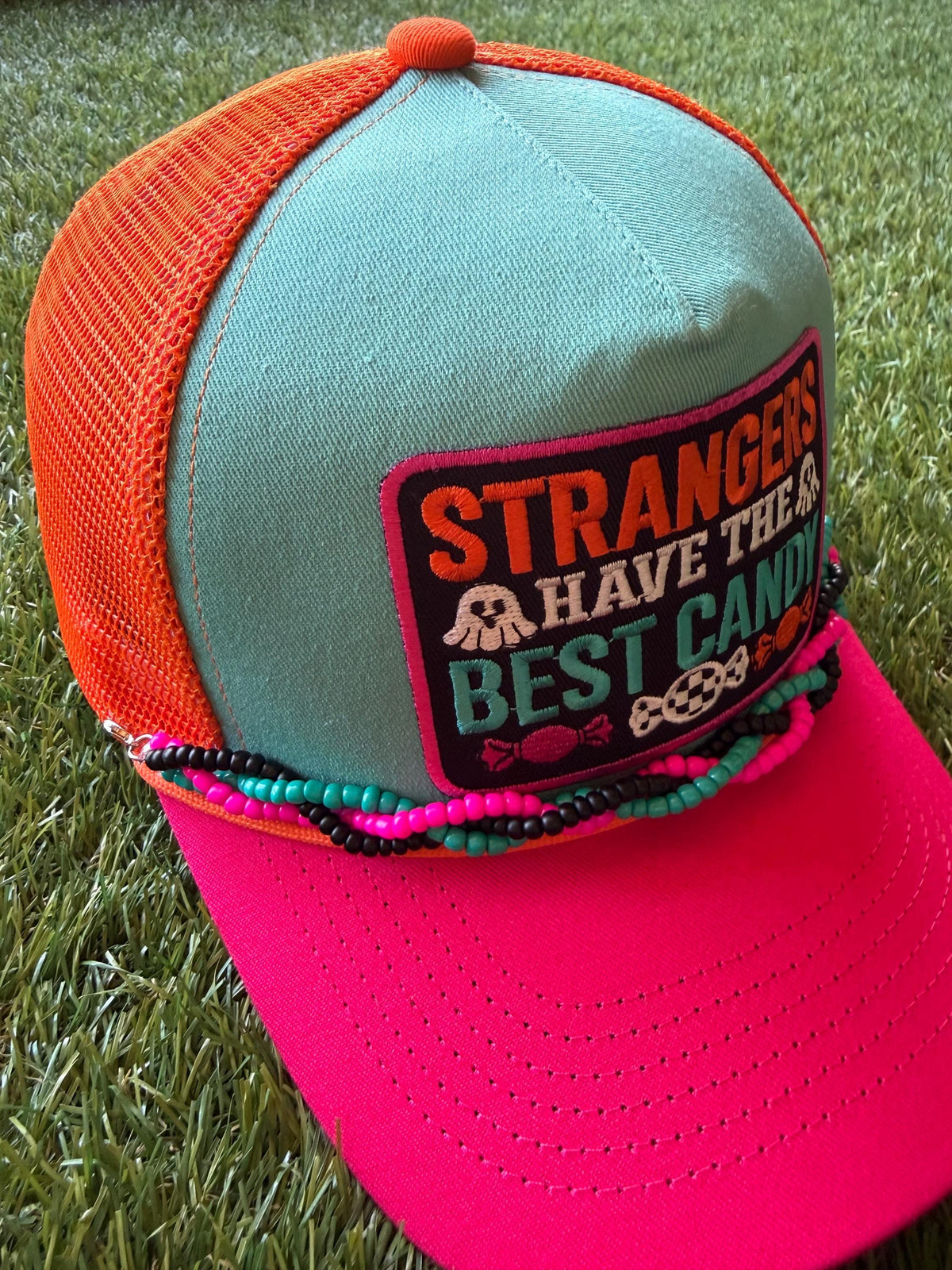 Strangers Have The Best Candy on a canvas and mesh custom trucker hat with a coordinating braided hat chain