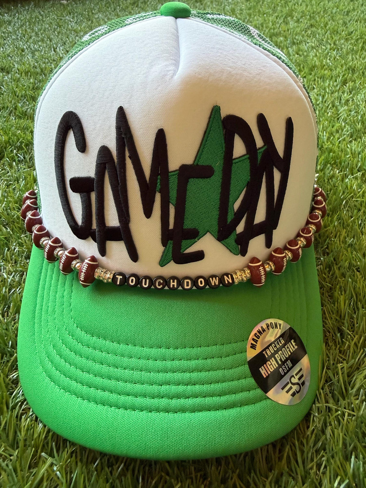 Gameday with a green star on a custom mesh magna pony trucker hat with a football hat chain