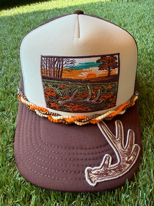 Deer Antler with Sunset embroidered patches on custom trucker hat with coordinating hat chain