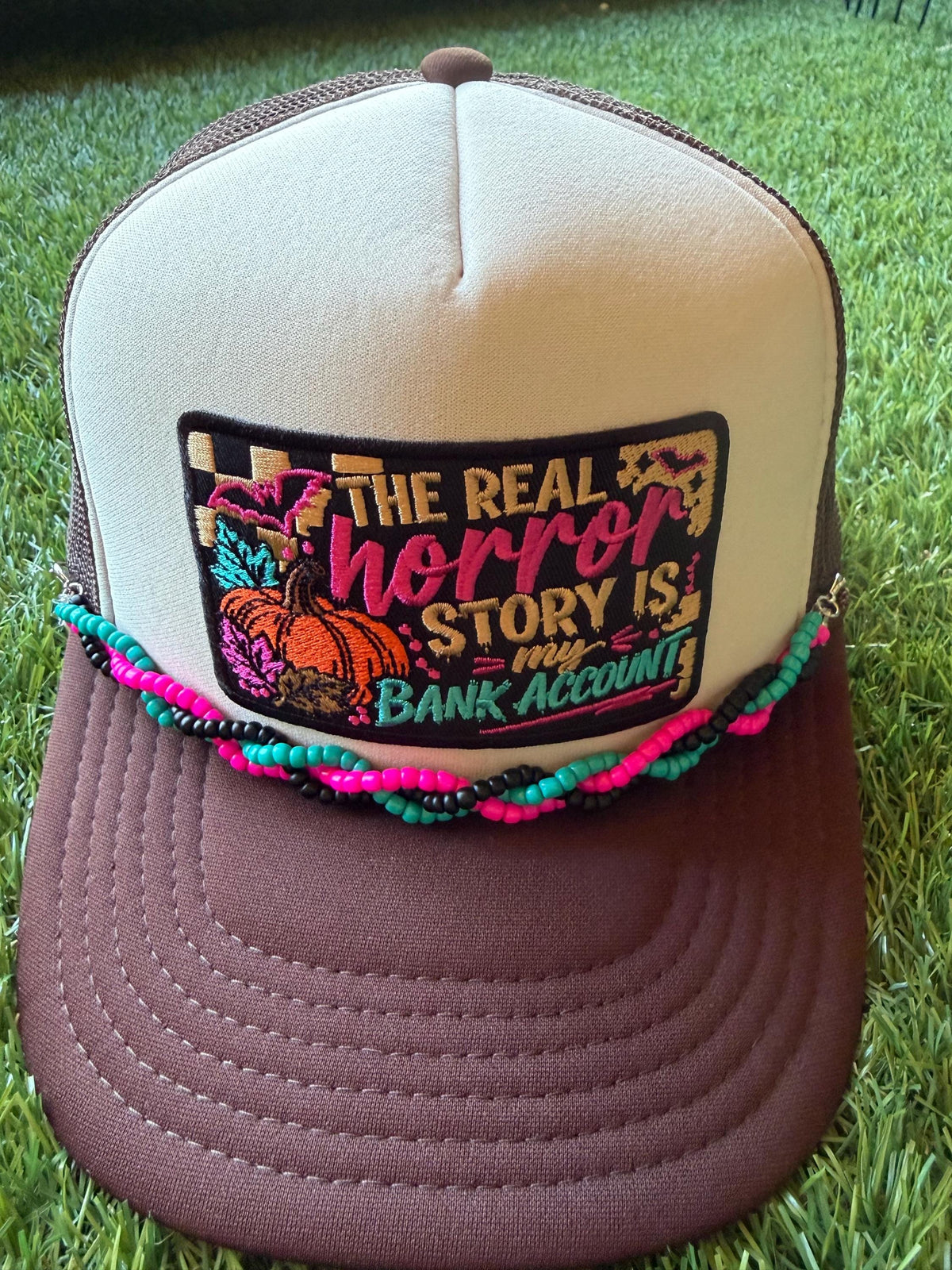 The Real Horror Story is My Bank Account on a custom mesh trucker hat with a coordinating rope hat chain