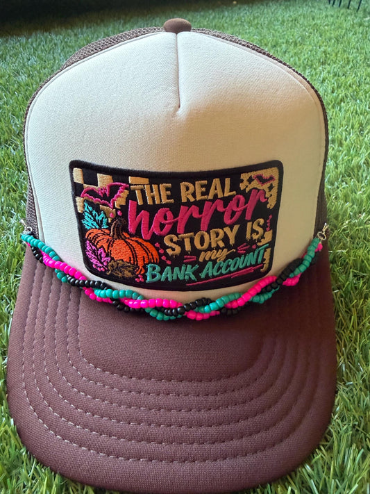 The Real Horror Story is My Bank Account on a custom mesh trucker hat with a coordinating rope hat chain