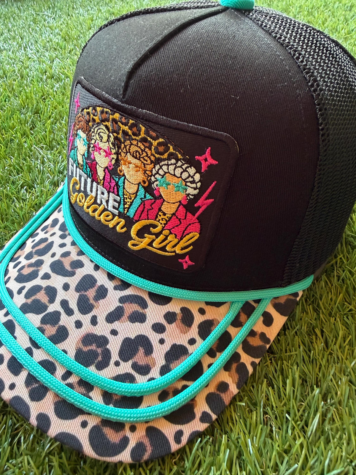 Future Golden Girl on a custom canvas trucker hat with a leopard brim and teal rope detailing