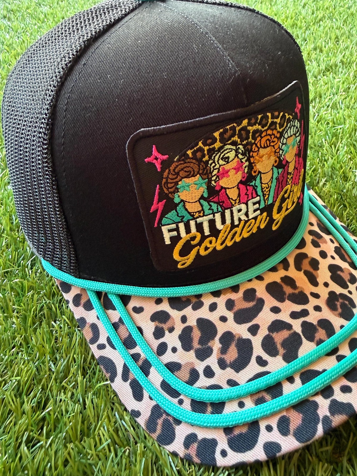 Future Golden Girl on a custom canvas trucker hat with a leopard brim and teal rope detailing