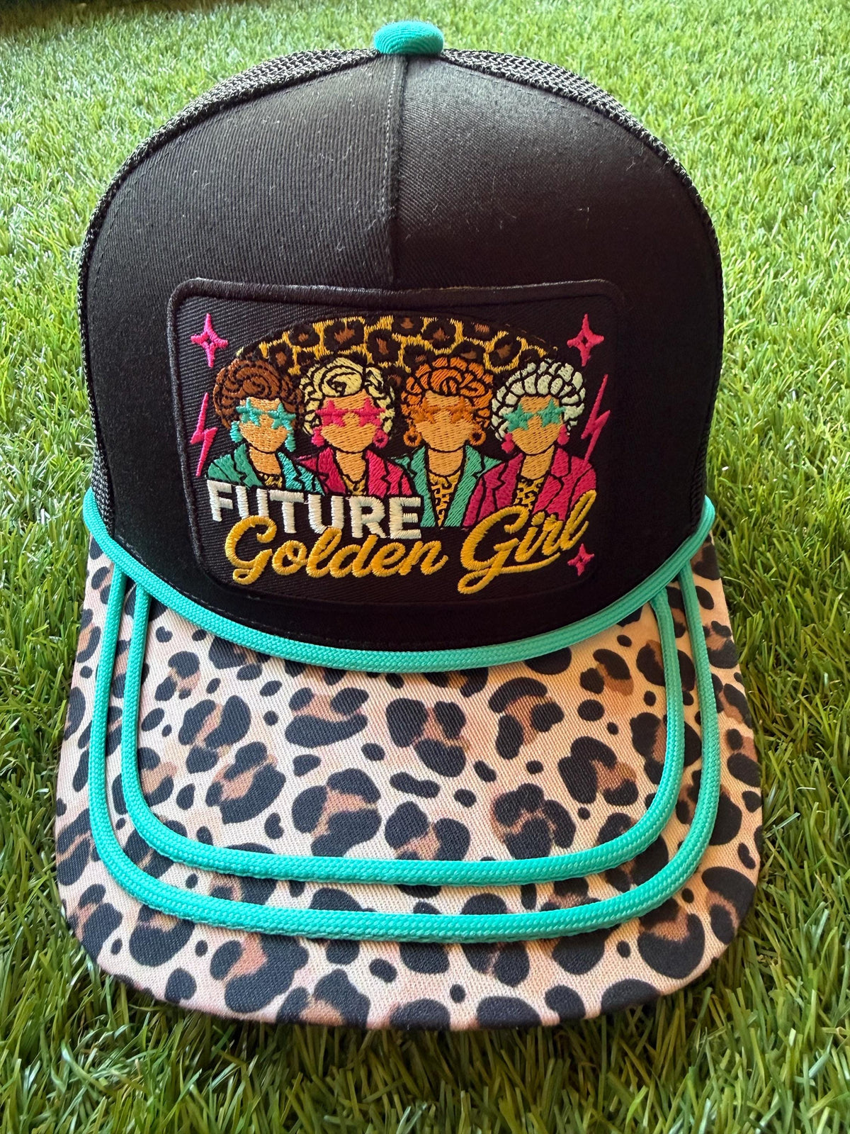 Future Golden Girl on a custom canvas trucker hat with a leopard brim and teal rope detailing