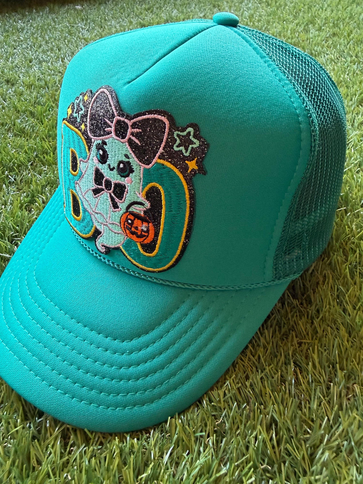 Boo with a friendly ghost on a jade Otto custom mesh trucker hat
