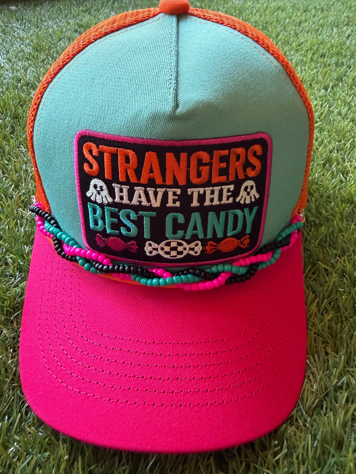 Strangers Have The Best Candy on a canvas and mesh custom trucker hat with a coordinating braided hat chain