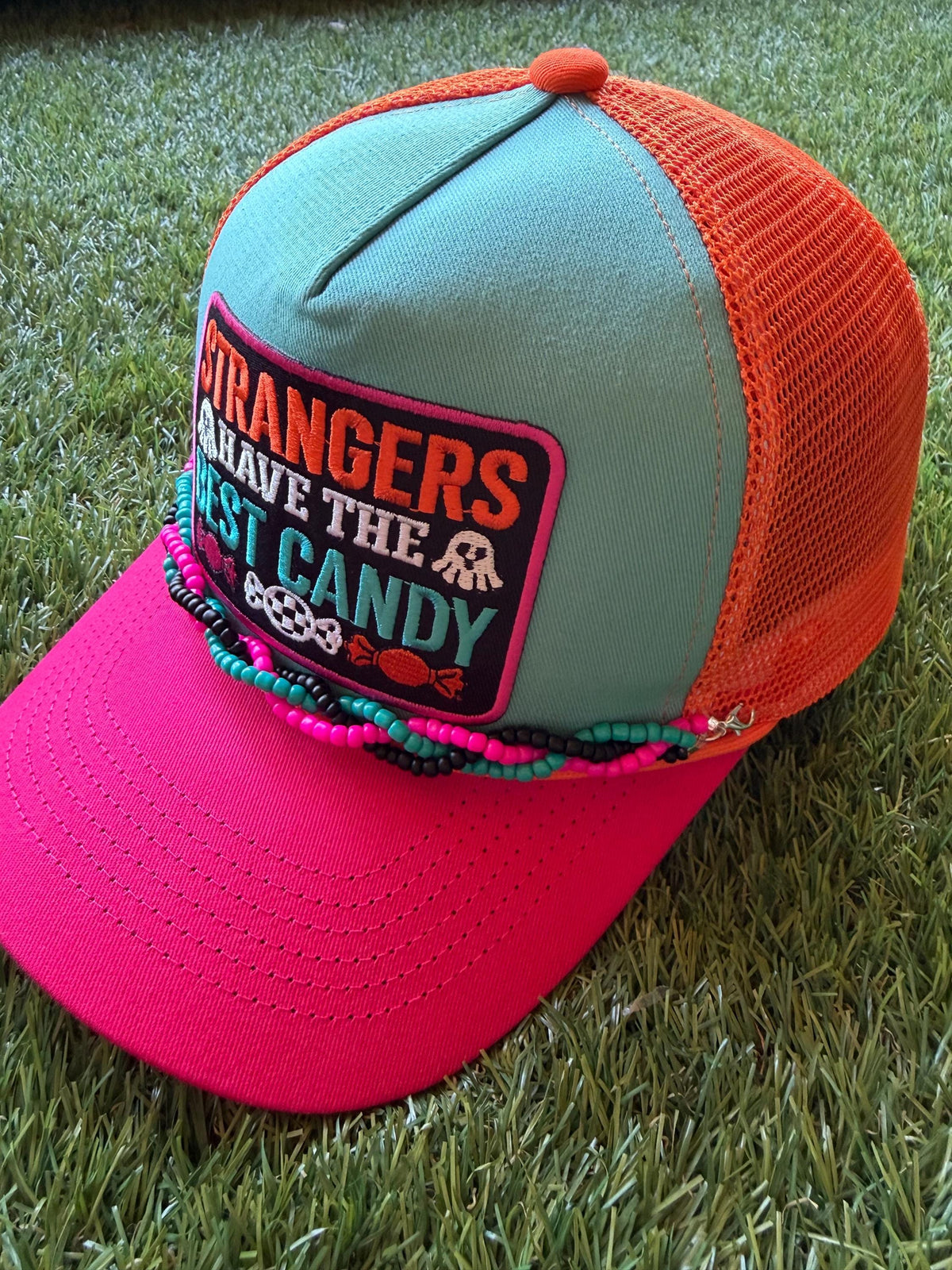 Strangers Have The Best Candy on a canvas and mesh custom trucker hat with a coordinating braided hat chain