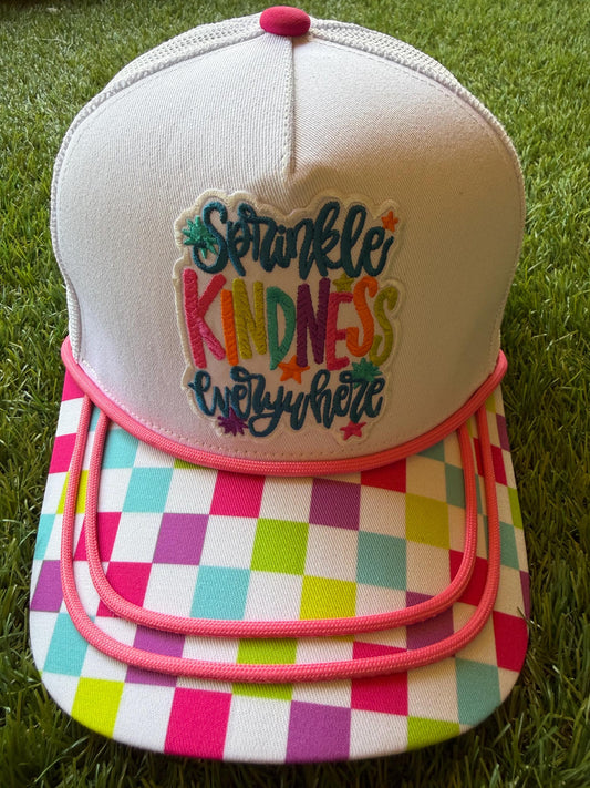 Sprinkle Kindness Everywhere colorful message on a multicolored canvas front with mesh back