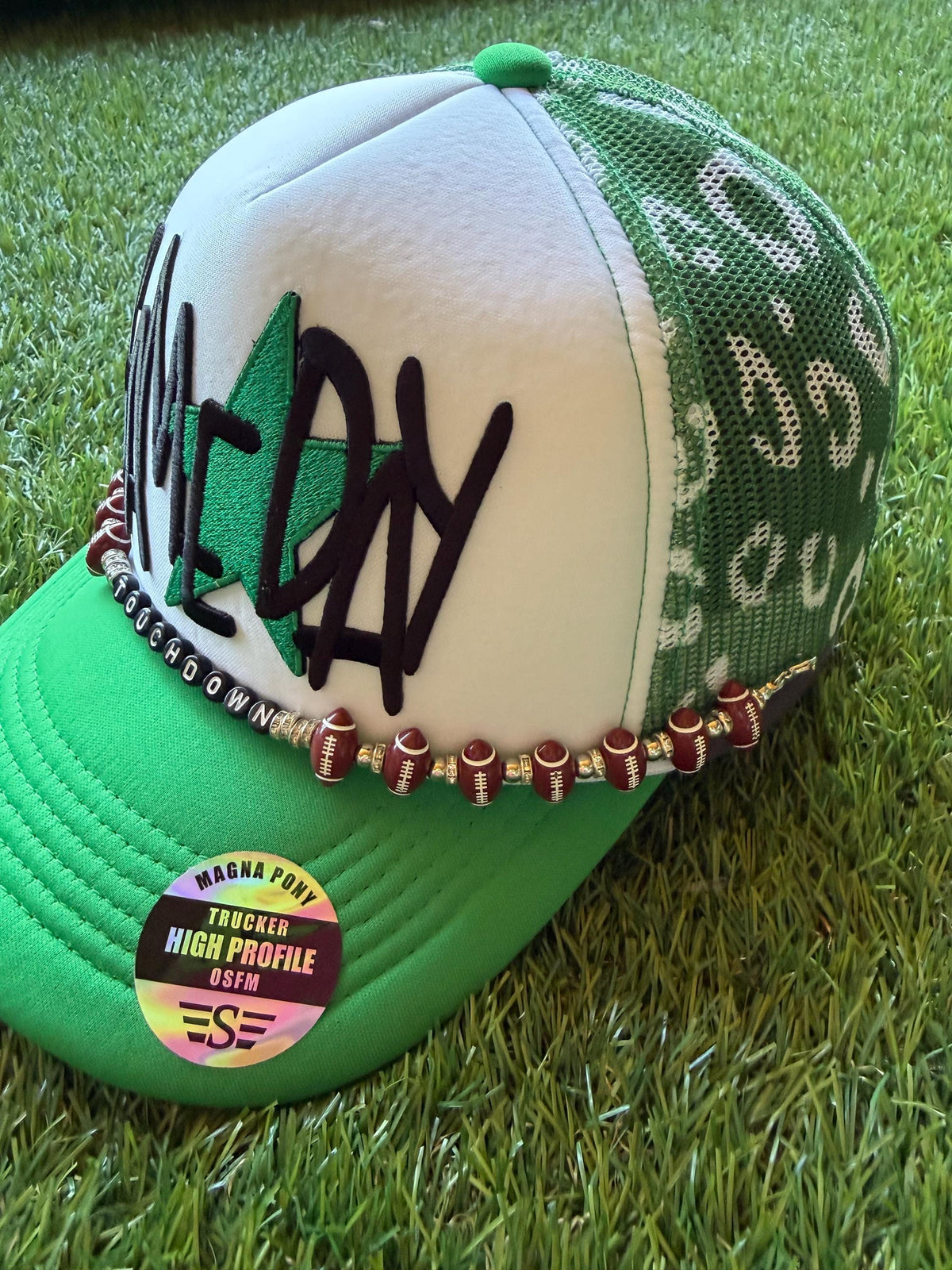 Gameday with a green star on a custom mesh magna pony trucker hat with a football hat chain