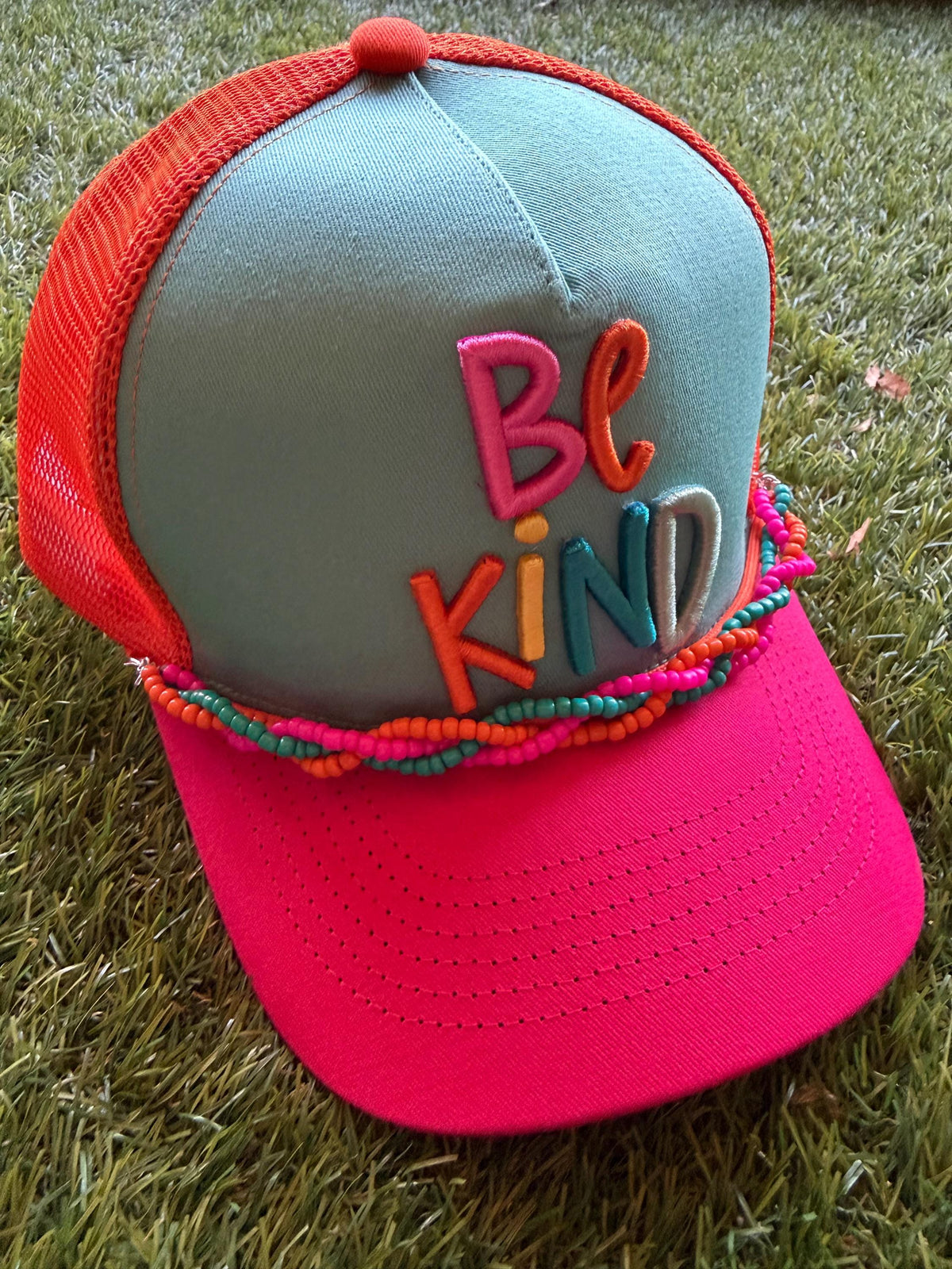 BE KIND embroidered word patch on custom canvas/mesh trucker hat with braided hat chain