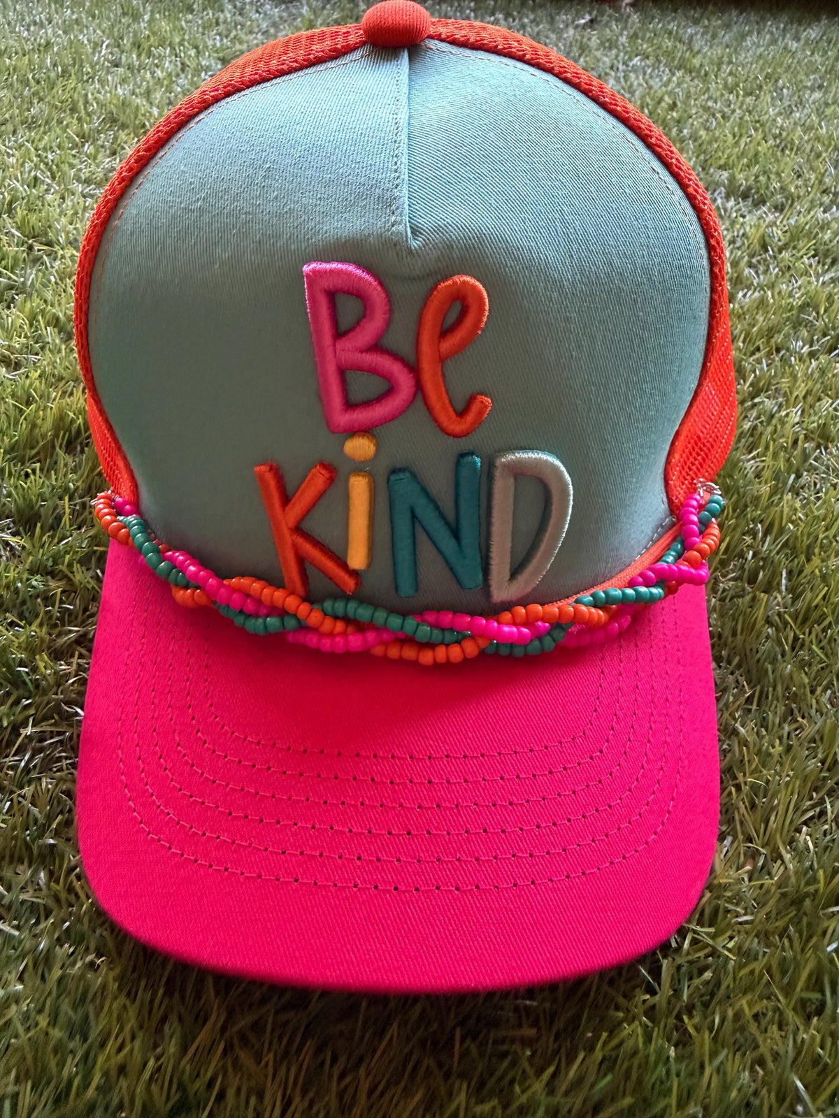BE KIND embroidered word patch on custom canvas/mesh trucker hat with braided hat chain