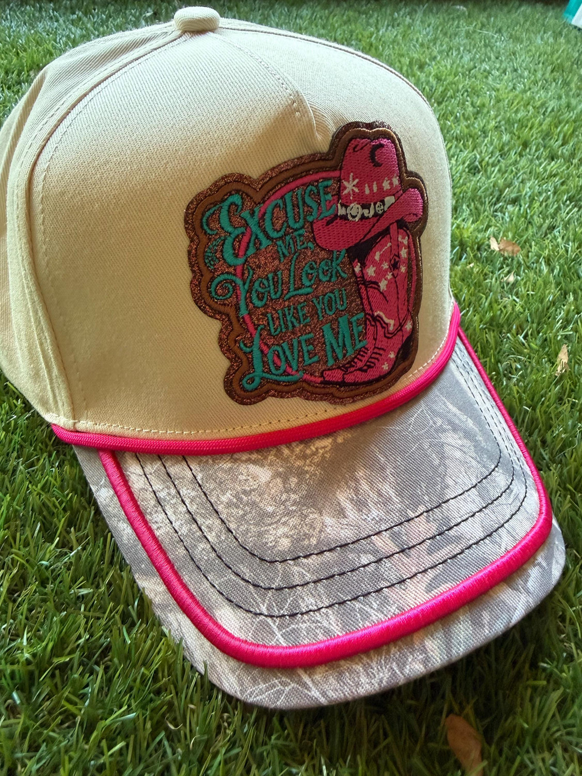 Excuse Me You Look Like You Love Me on custom canvas trucker hat with camouflage brim and hot pink trim
