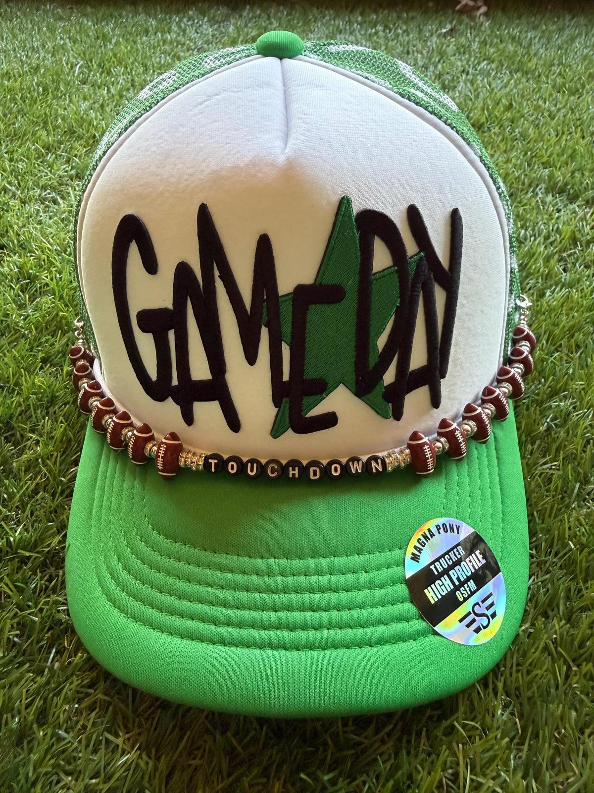 GAMEDAY with green star embroidered patch on custom mesh trucker hat with hat chain