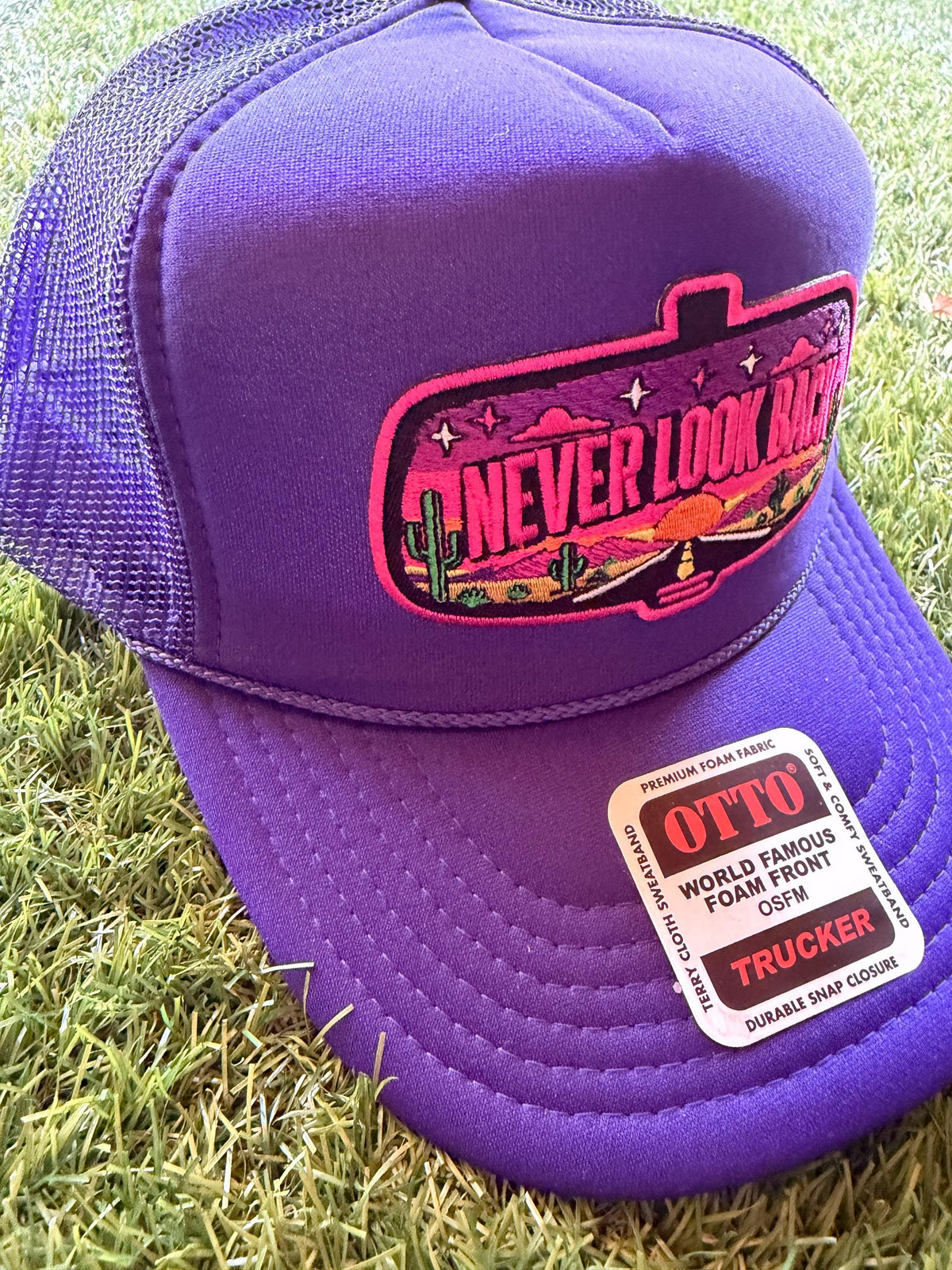 Never Look Back embroidered patch on a custom mesh trucker hat