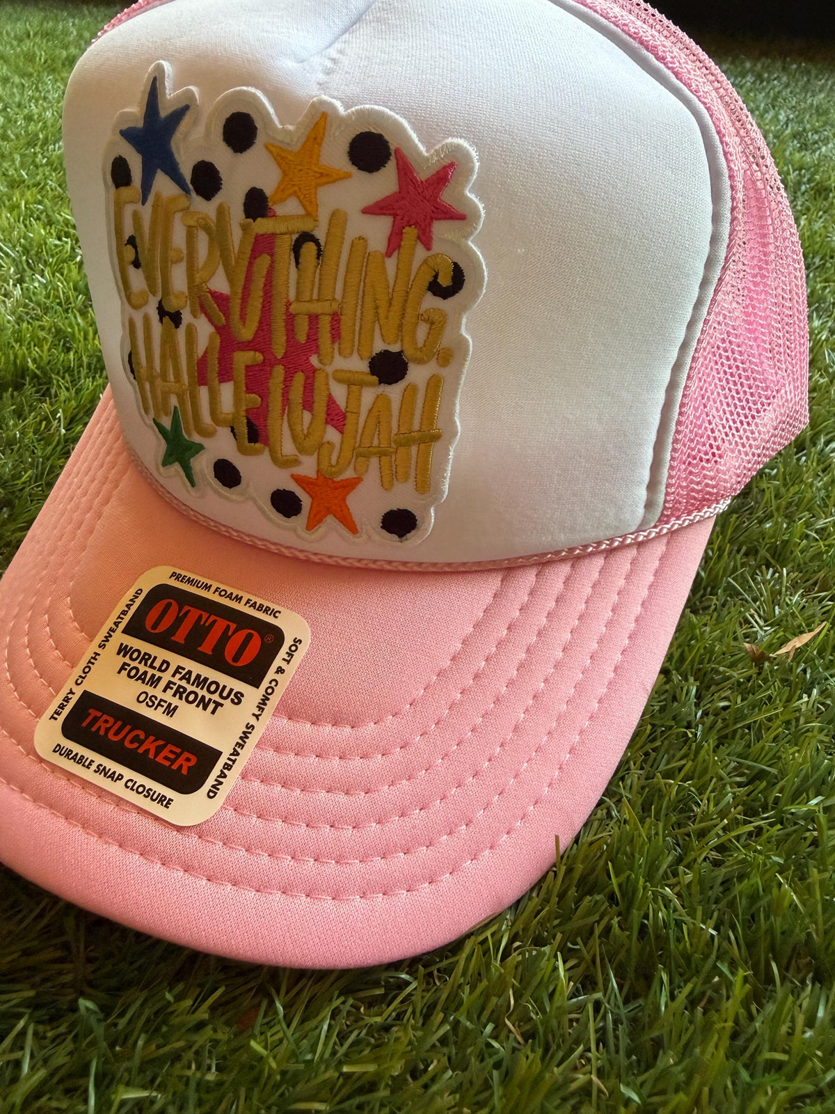 Everything Hallelujah embroidered patch on an Otto light pink custom mesh trucker hat