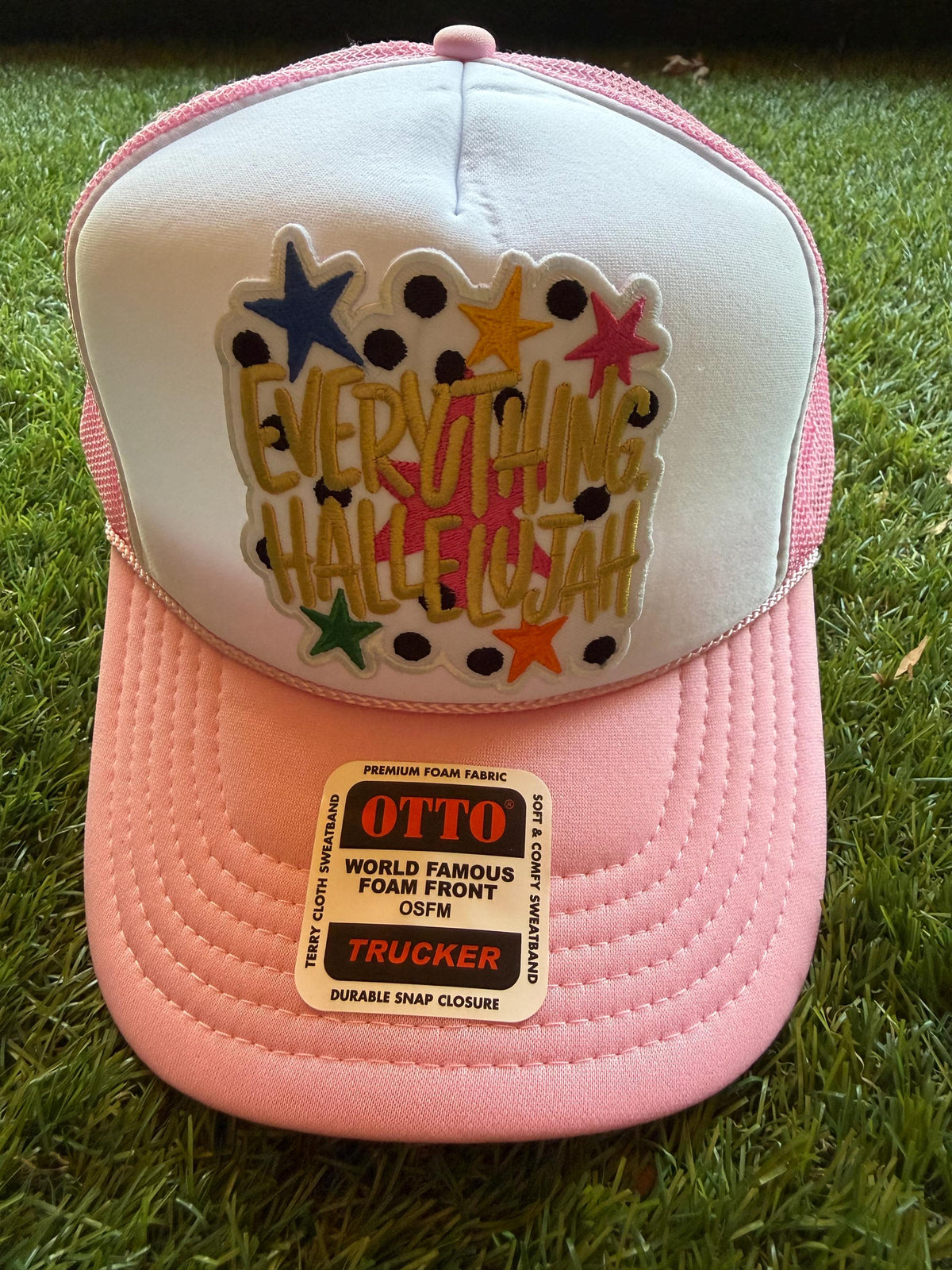 Everything Hallelujah embroidered patch on an Otto light pink custom mesh trucker hat