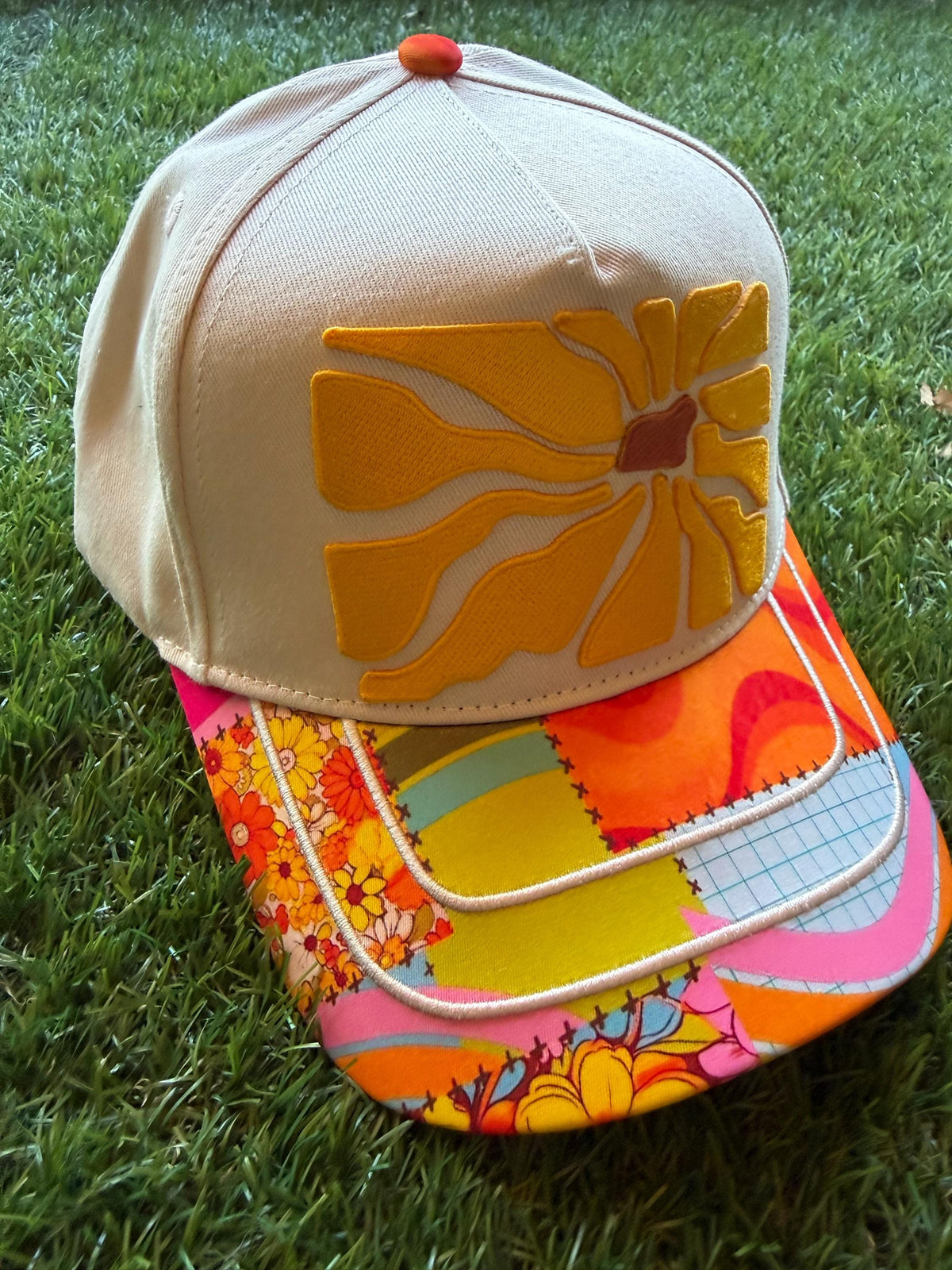 Floral embroidered patch on custom canvas trucker hat with boho style brim