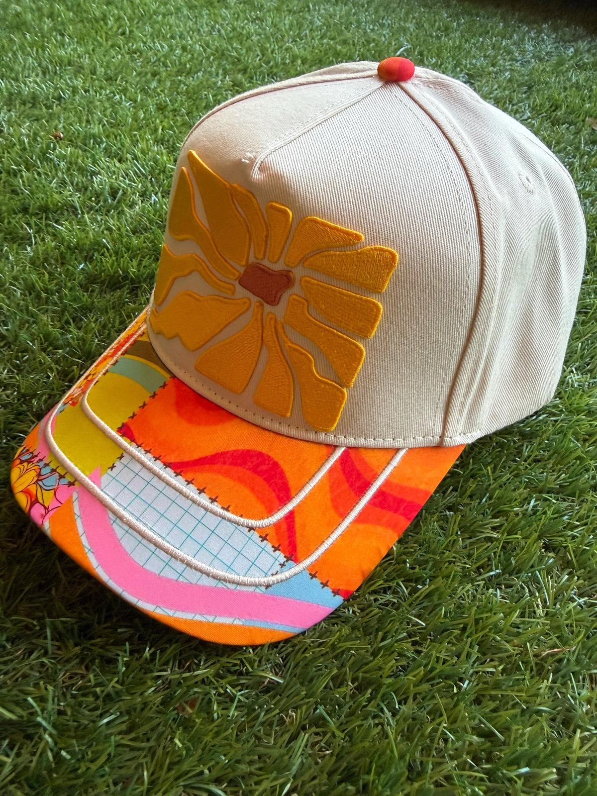 Floral embroidered patch on custom canvas trucker hat with boho style brim