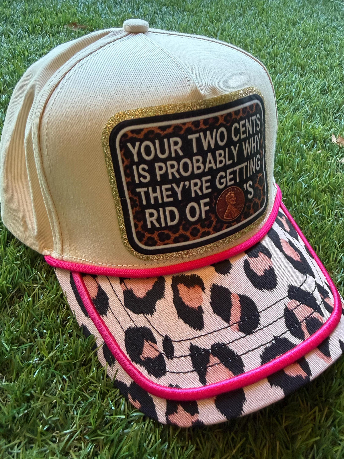 Your Two Cents Are Probably Why They Are Getting Rid of Pennies on a custom canvas trucker hat with leopard brim and hot pink detail