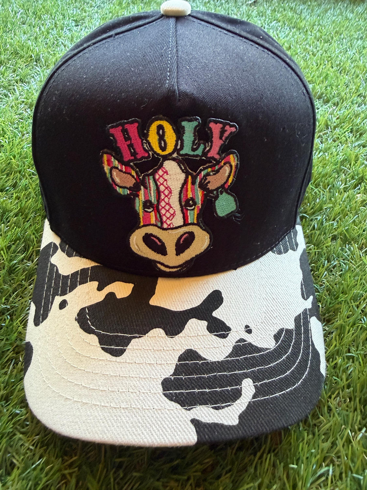 Holy Cow on a custom canvas trucker hat with cow brim