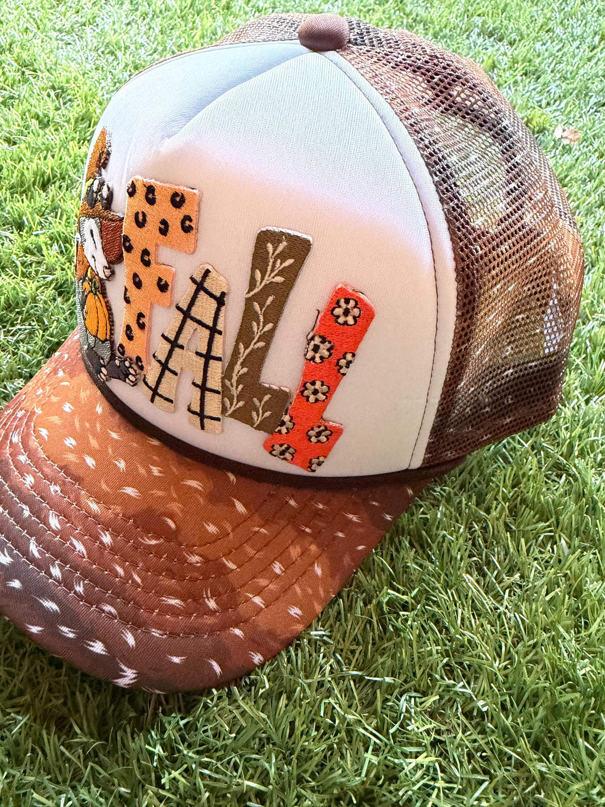 FALL embroidered patch on a custom mesh trucker deer print brim