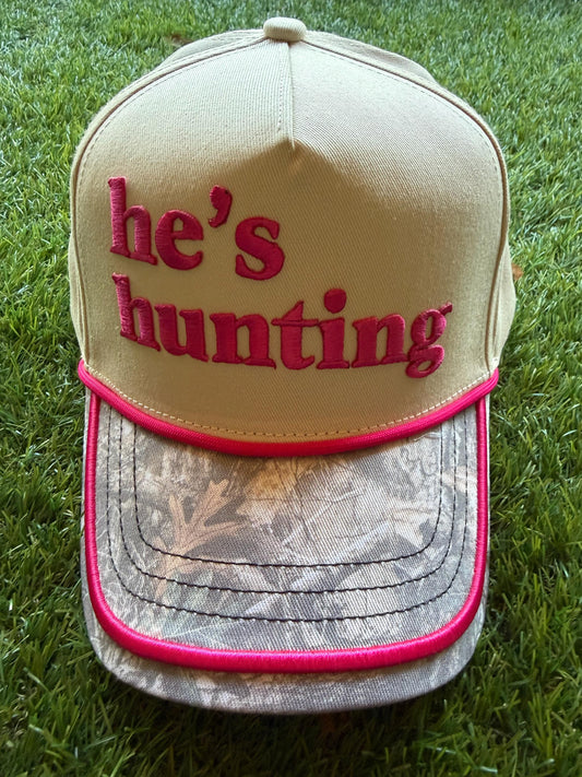 HE"S HUNTING embroidered letter patch on custom canvas trucker hat with a camouflage brim